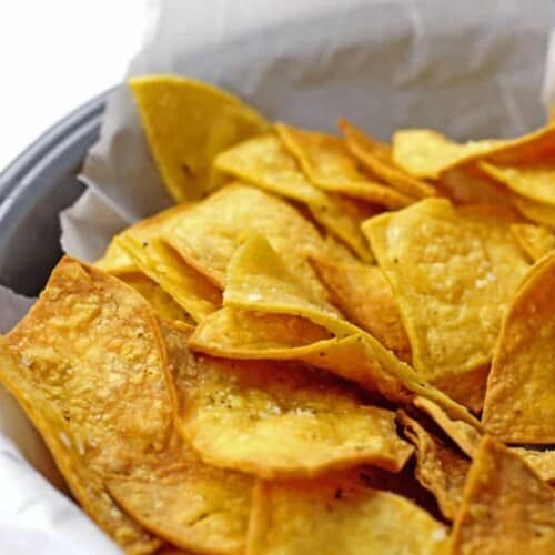 Close up of air fryer tortilla chips in a bowl.