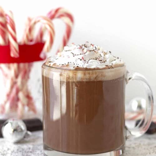 mocha drink in a mug with candy canes.