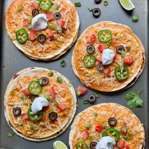 Vegan Mexican pizzas on a sheet pan.