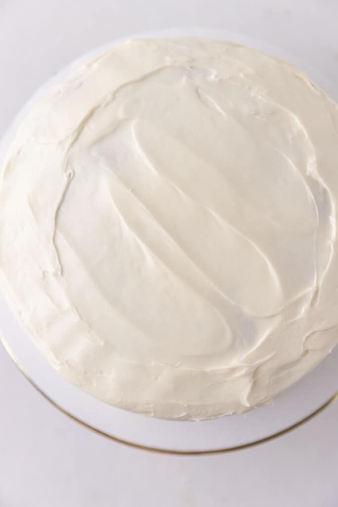 Cream cheese frosting on a cake.