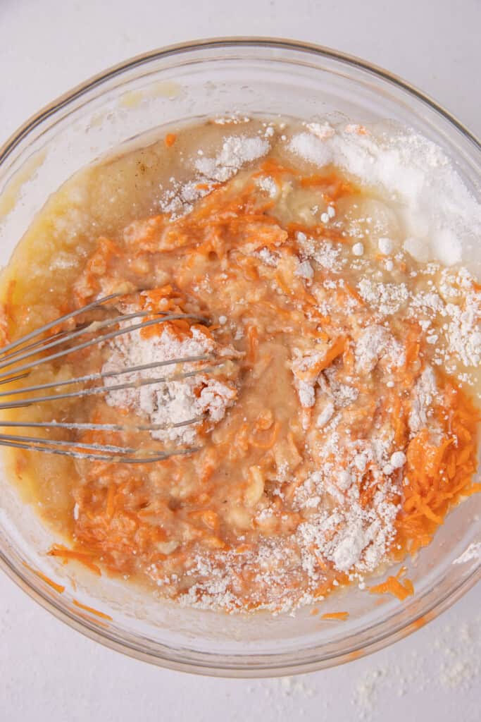 flour and carrots in a bowl.