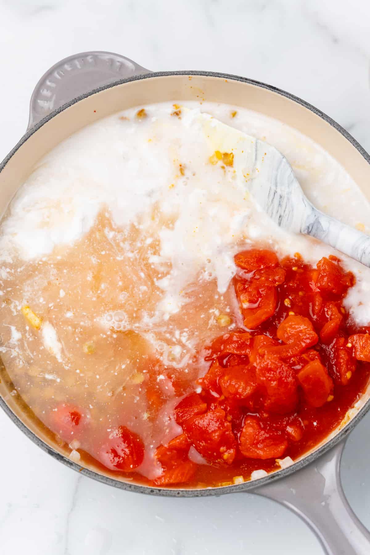 Coconut milk and diced tomatoes.