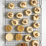 maple pecan cookies on a rack with a few topped with maple glaze and pecans - feature