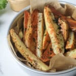 Air Fryer Steak Fries in a serving container with parchment paper - feature image