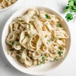 Truffle Pasta in a white bowl garnished with parsley - feature