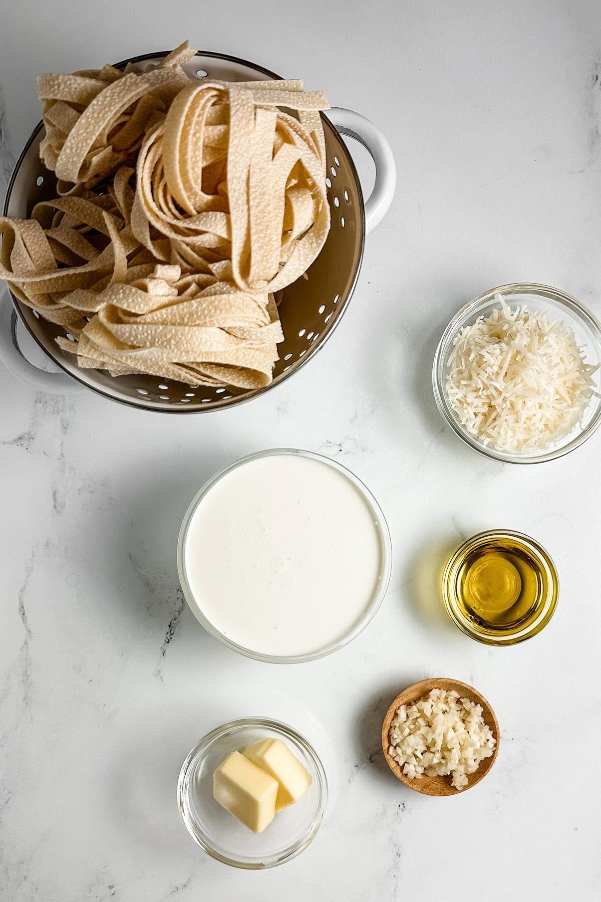 Ingredients for truffle pasta on a white backdrop
