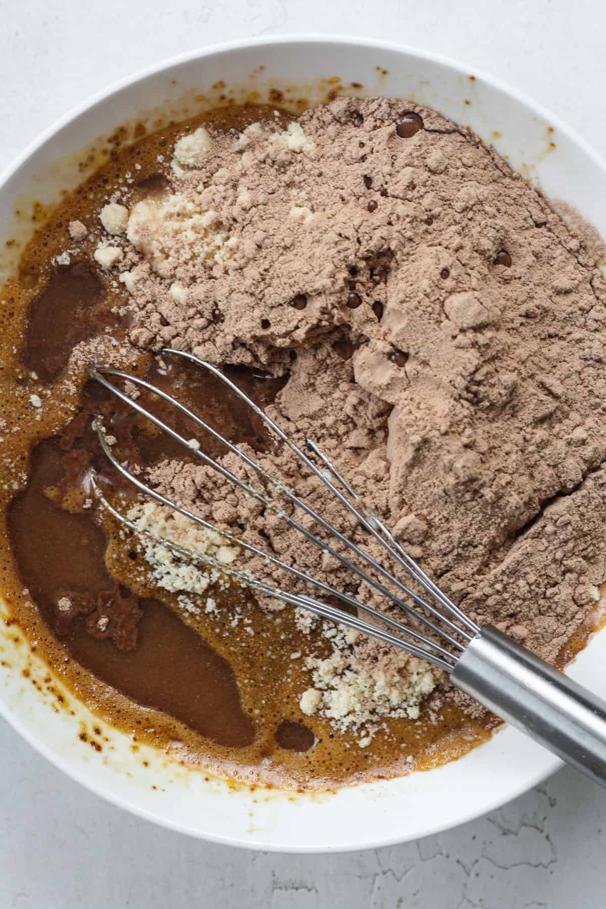 Step 1 to make banana brownies - mix wet and dry ingredients