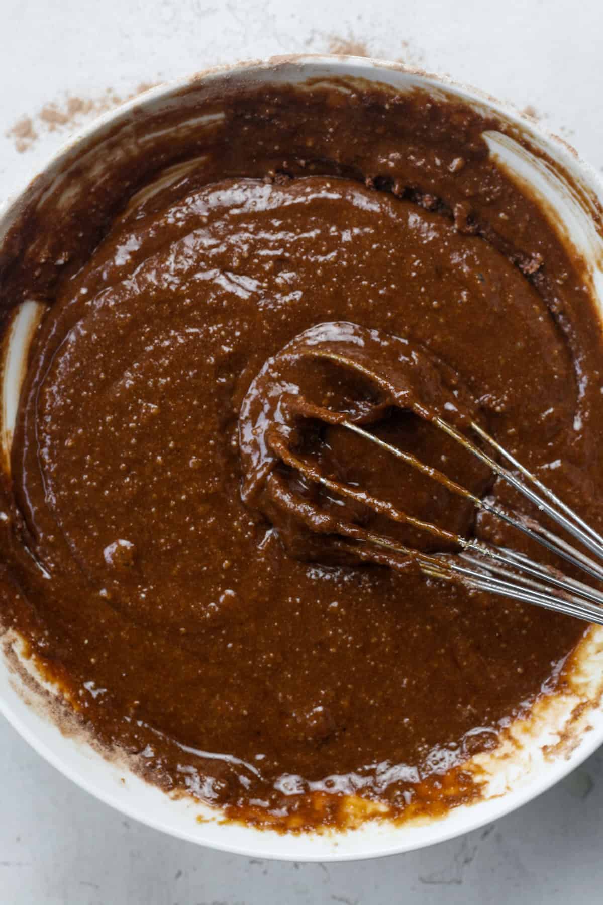 mixing mashed bananas for vegan chocolate banana brownies