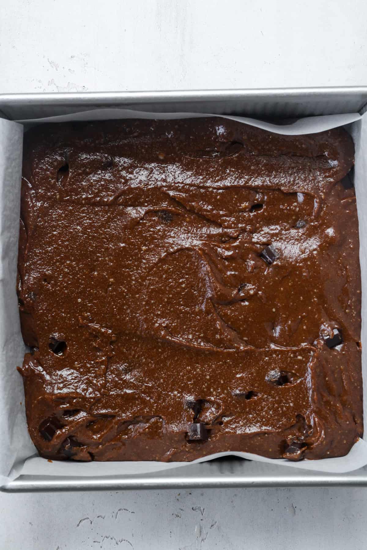 Step 4 of chocolate banana brownie - spreading the batter in a baking pan