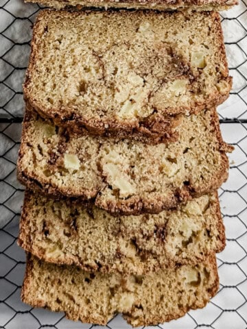 feature image - overhead shot of a loaf of gluten free cinnamon apple bread cut into slices