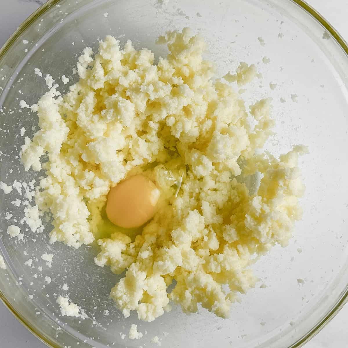 step 3 - adding eggs to whisked butter and sugar