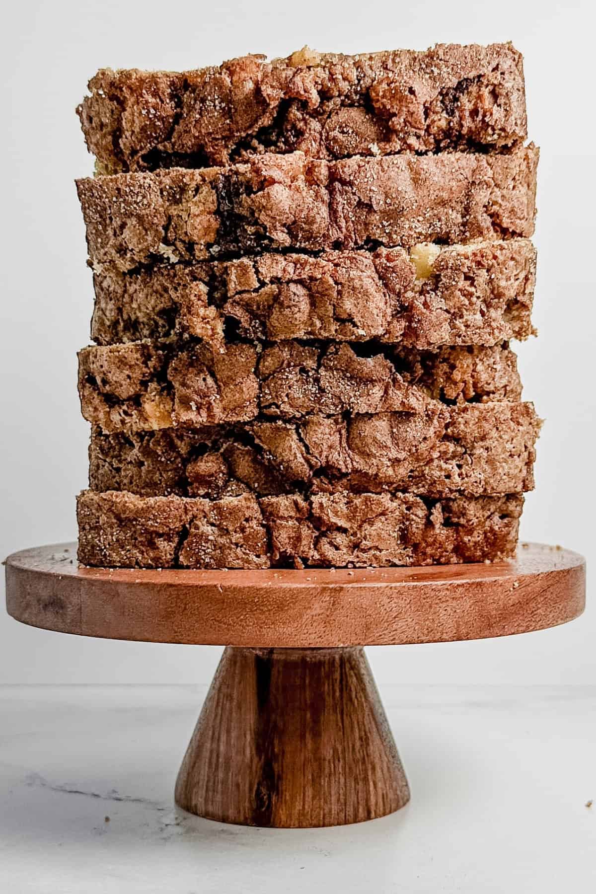 Stack of cinnamon apple bread on wooden block