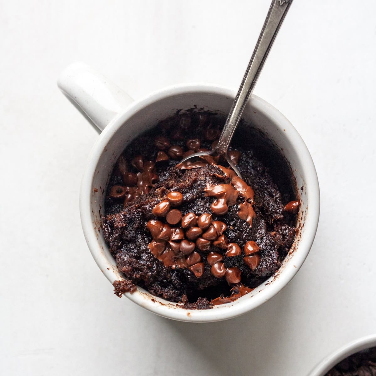 Chocolate Chip Mug Cake - Featured with warm sprinkled dairy free chocolate chips