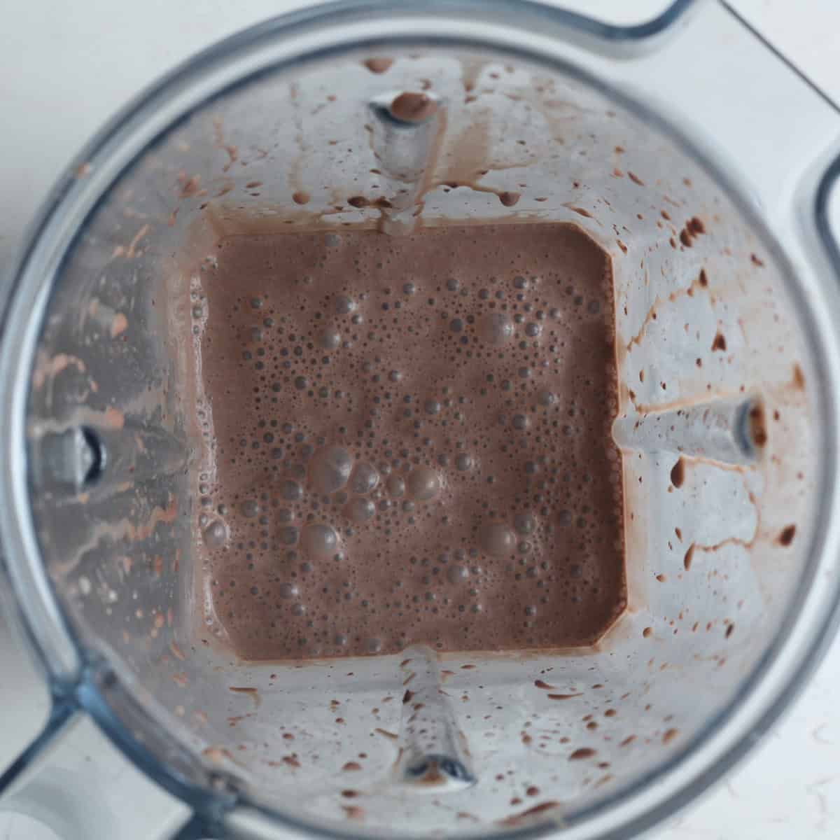 chocolate protein shake blended in a blender