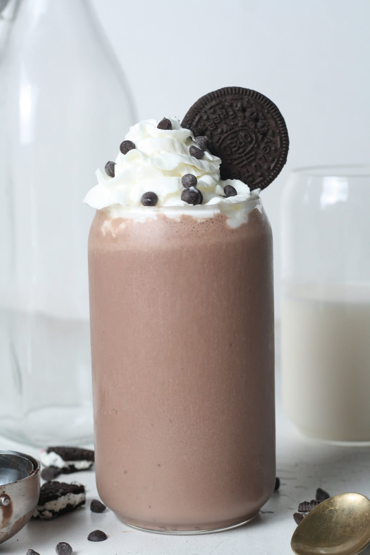 oreo protein shake topped with whipped cream and chocolate chips - side shot