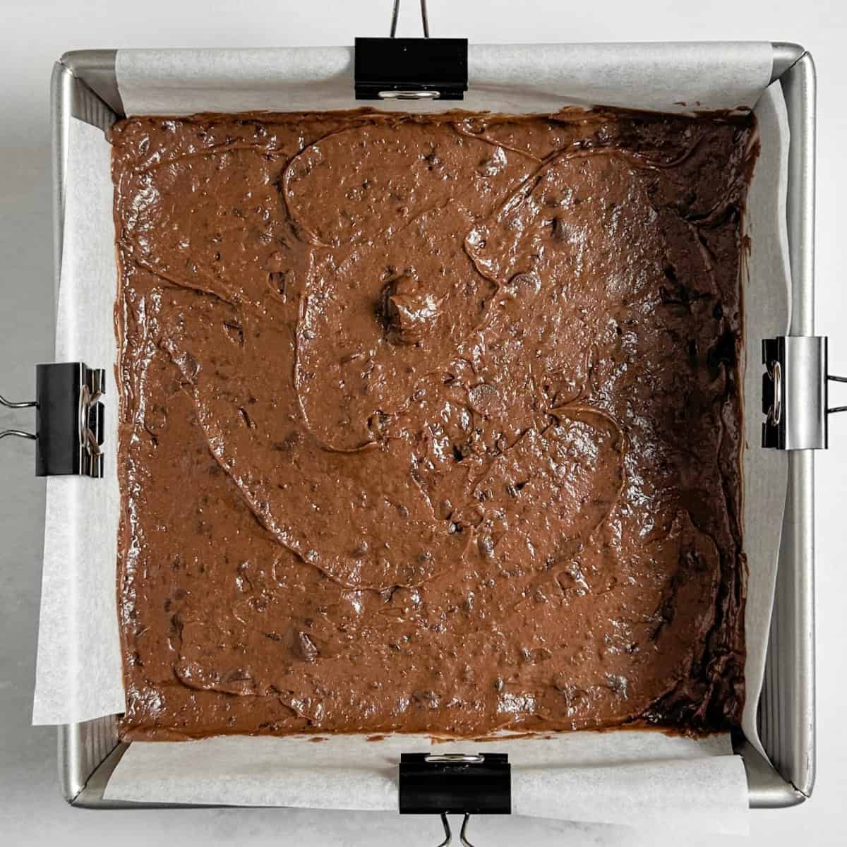 step 3 of making vegan black bean brownies - spreading the batter in a baking pan
