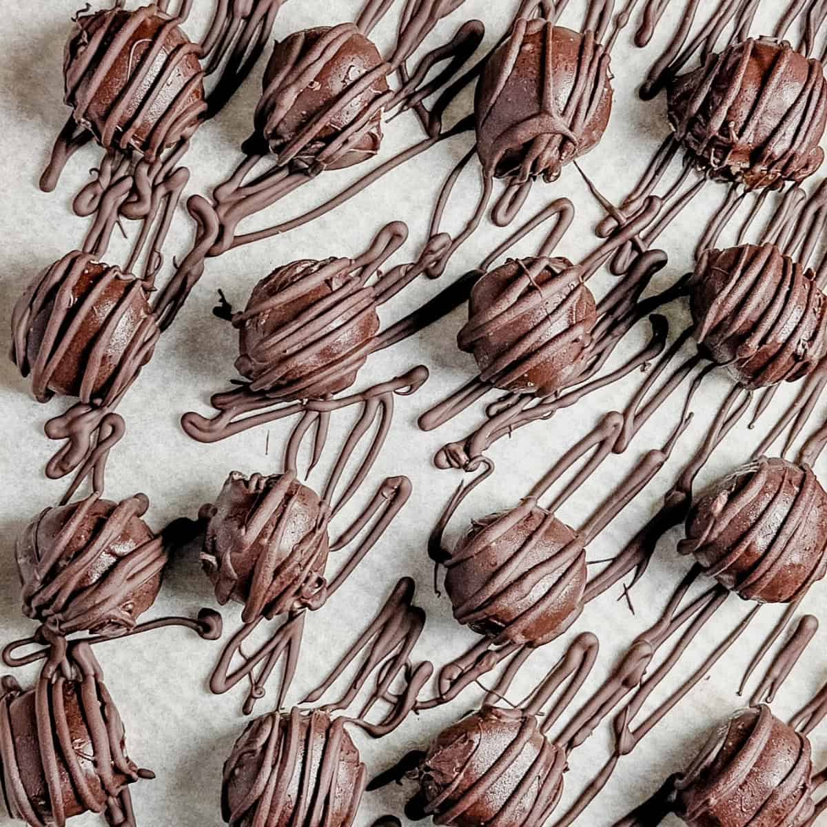 Chocolate drizzle on peanut butter truffles