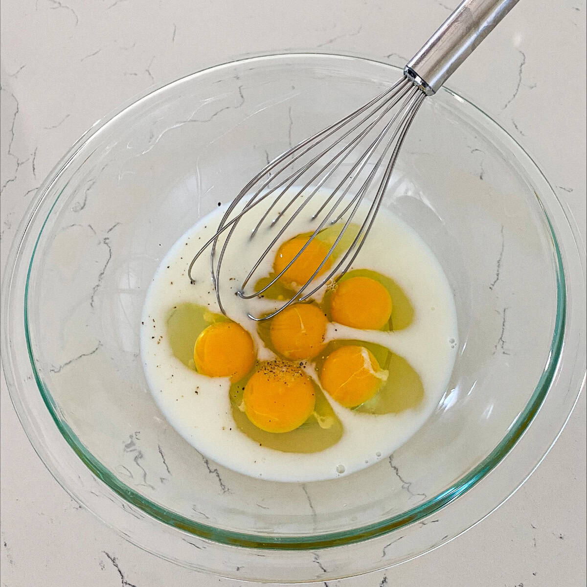 Mixing the eggs and milk - step 2 to make the frittata