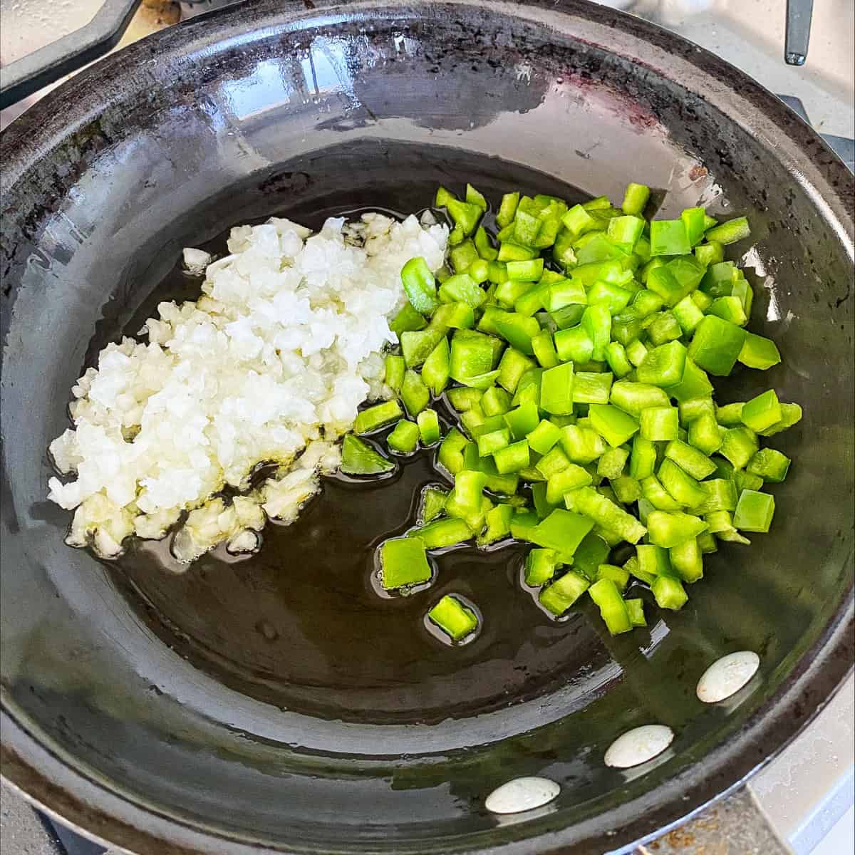 Cooking veggies in skillet to make a veggie loaded frittata