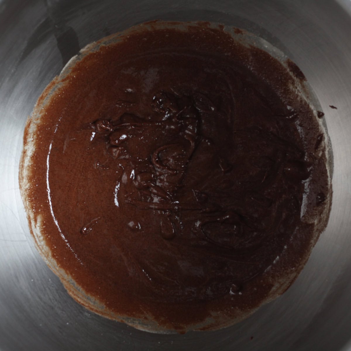 step by step of making the baked oatmeal brownies - mixing wet and dry ingredient base