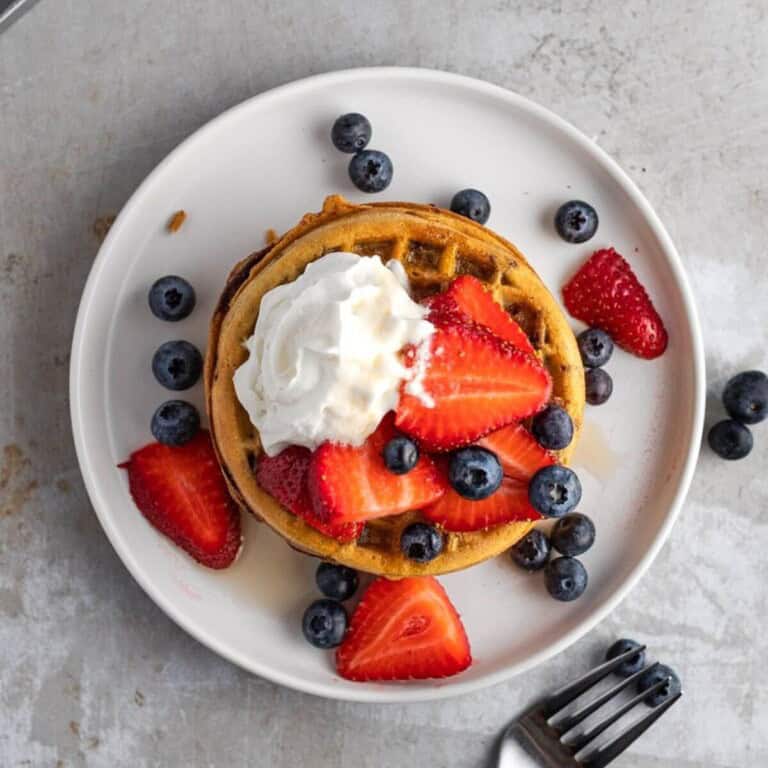 overhead Air Fryer Eggo Waffles topped with blueberries, whipped cream, and strawberries