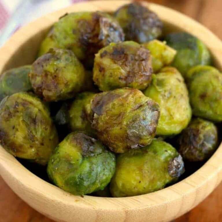 overhead Frozen Brussel Sprouts in a wooden bowl