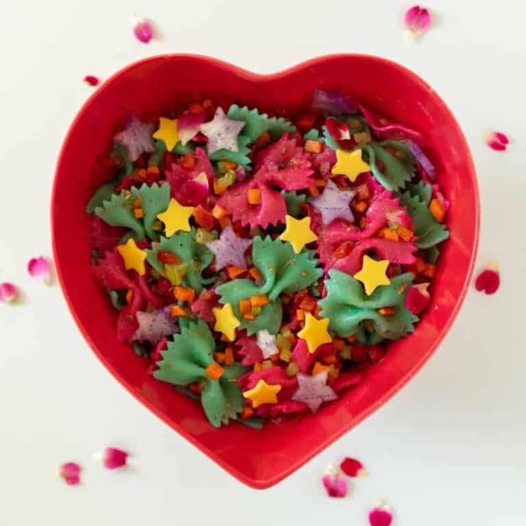 rainbow pasta salad in a heart shaped plate