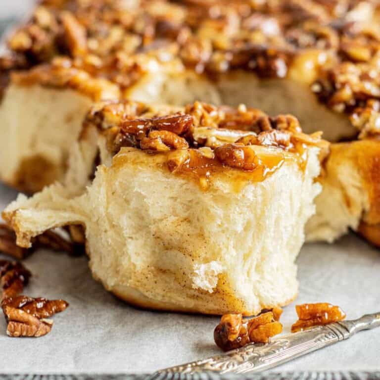 Small batch sticky buns with caramel glaze on a serving tray