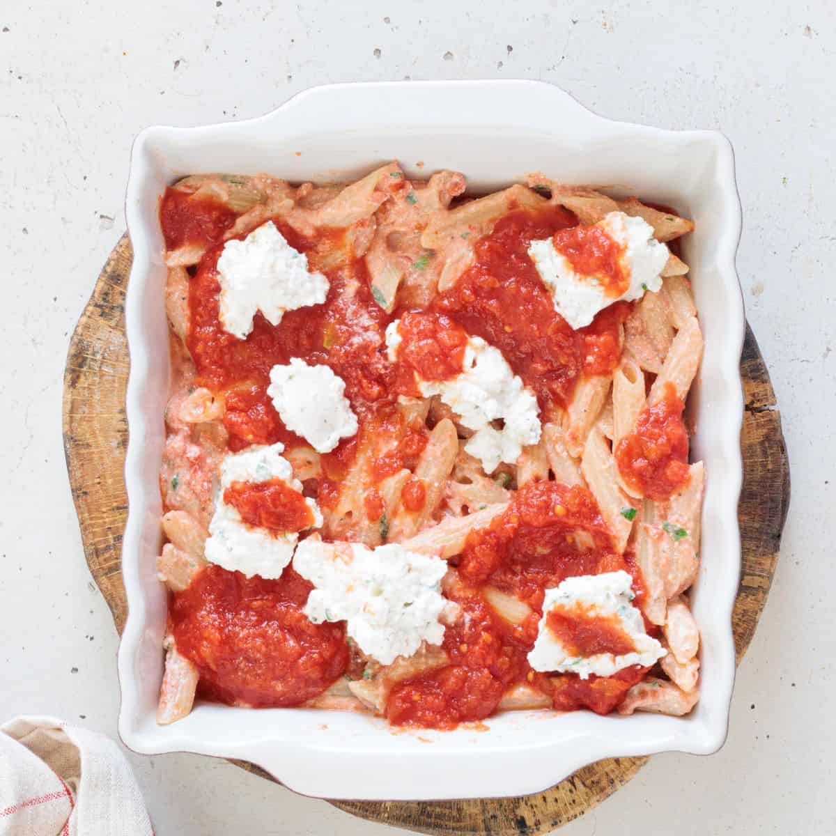 overhead of vegan ziti mixture in a casserole dish before putting it in the oven.
