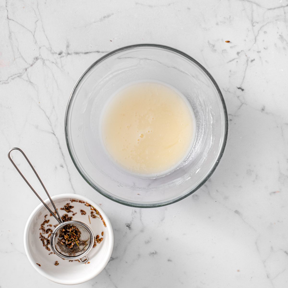 Lavender icing made by soaking cooking lavender and mixing it with powdered sugar.