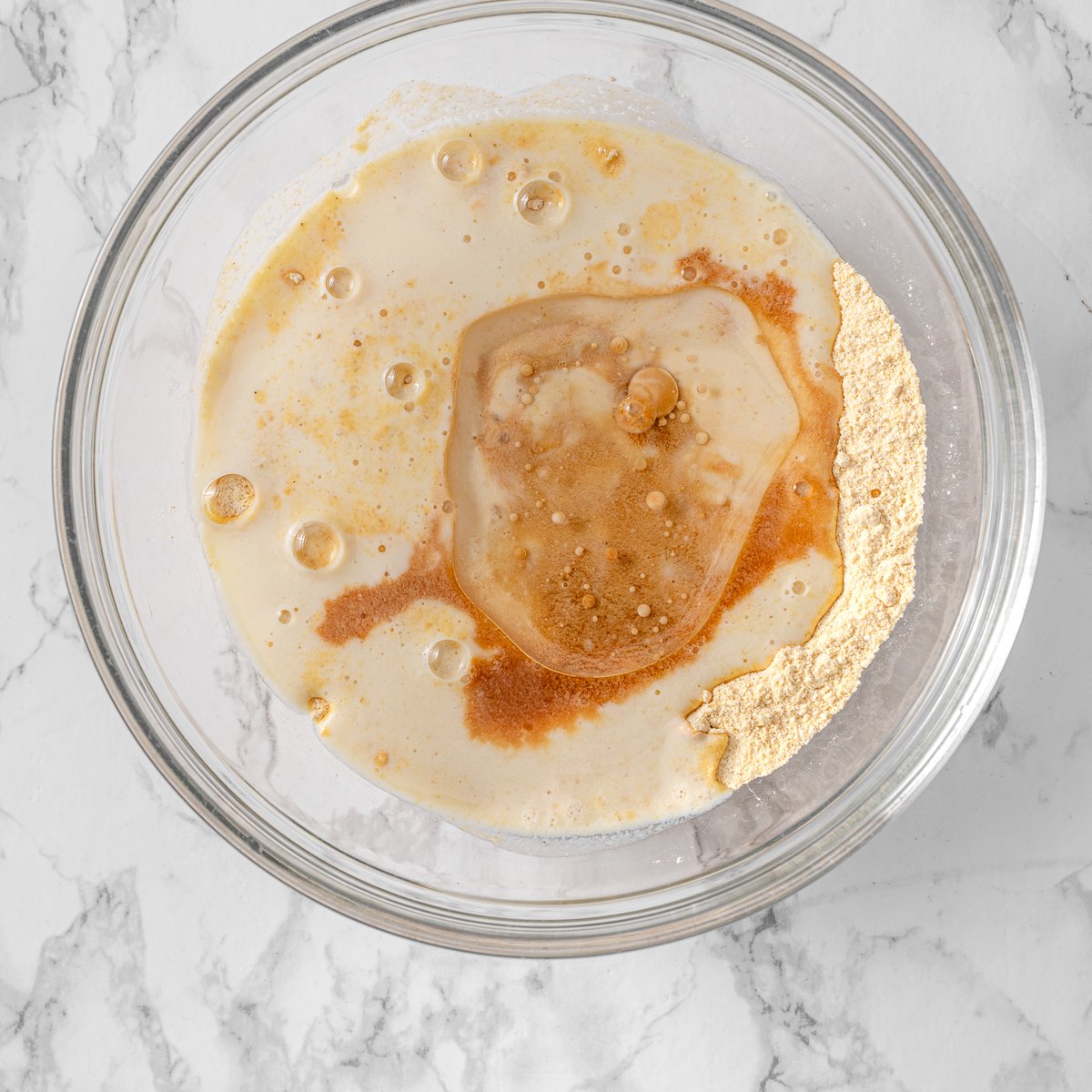mixing dry ingredient with buttermilk to make chickpea pancake batter