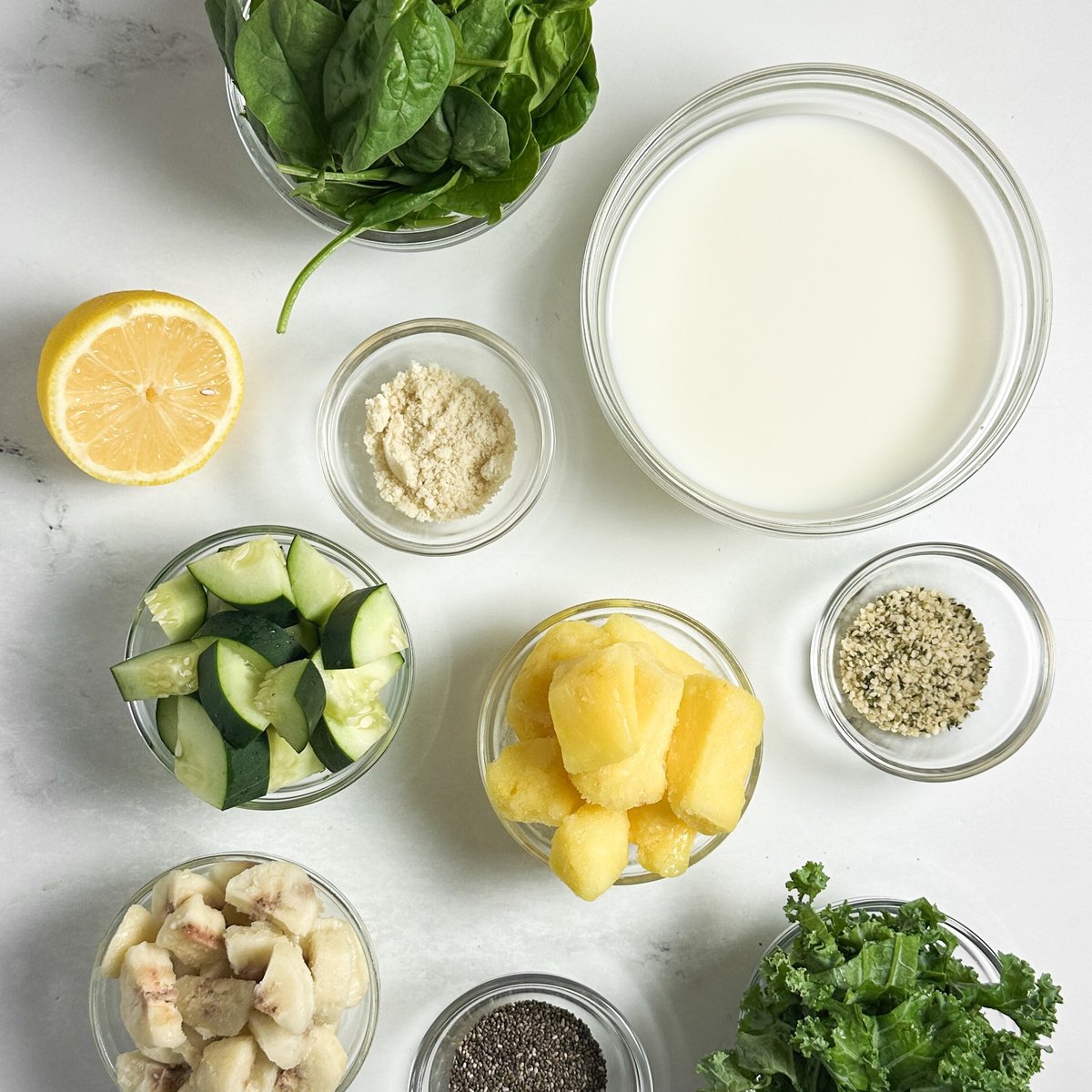 Frozen banana chunks, spinach, and kale in a blender