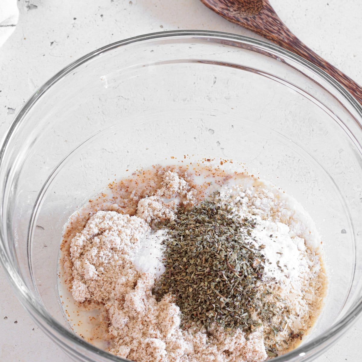 Dry ingredients for vegan almond flour biscuits in a mixing bowl