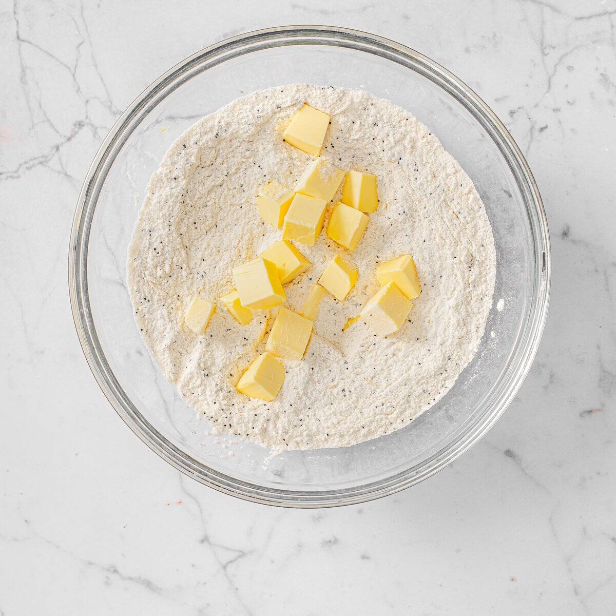 Cut the cold vegan butter into the flour mixture with your fingertips.