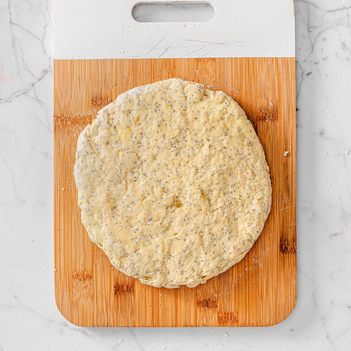 Shape the dough for vegan lemon poppy seed scones 