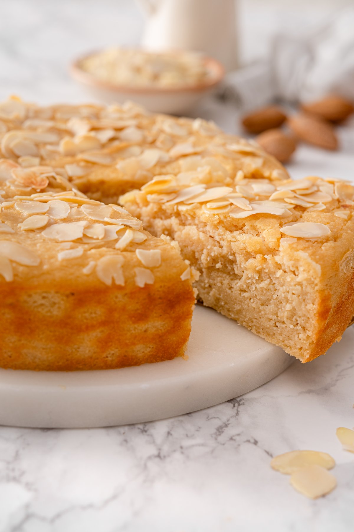 Close-up of almond ricotta cake texture showing moist crumb