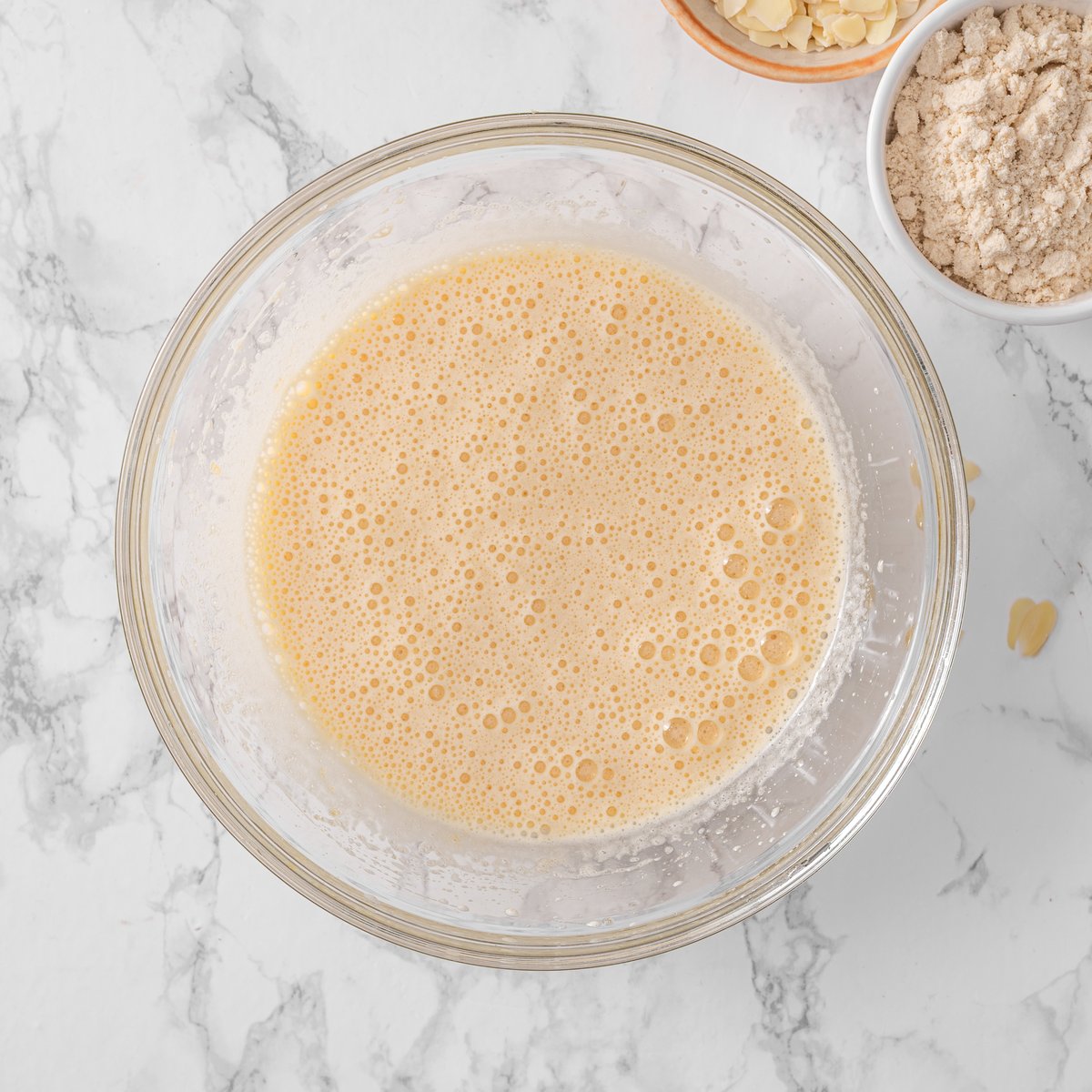 Eggs and sugar beaten until pale and fluffy in a bowl