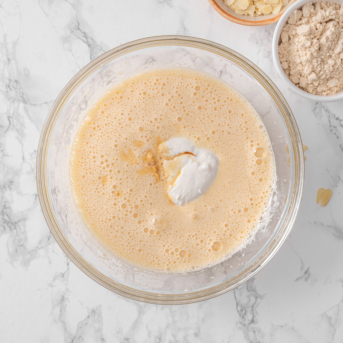 Ricotta and vanilla being added to egg mixture